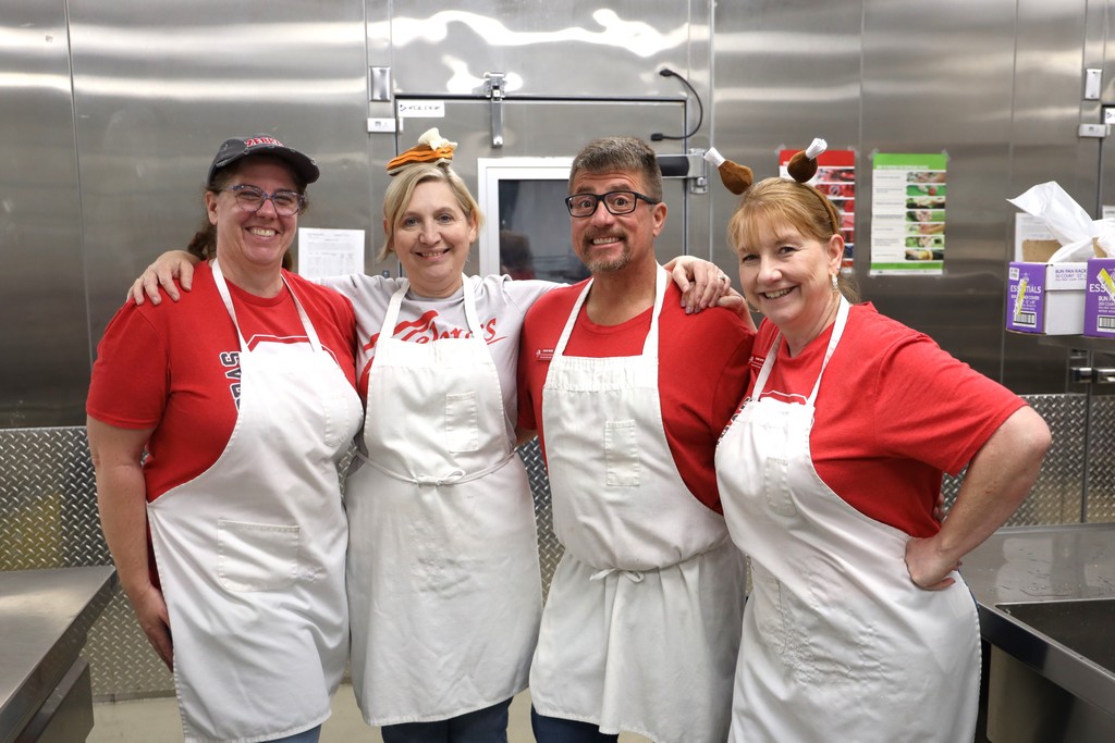 staff serving thanksgiving meal