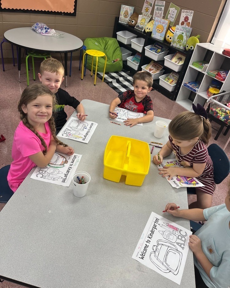 students working around a table 