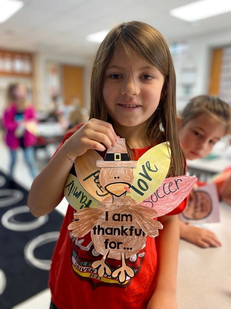 First grader with their thanksgiving project.