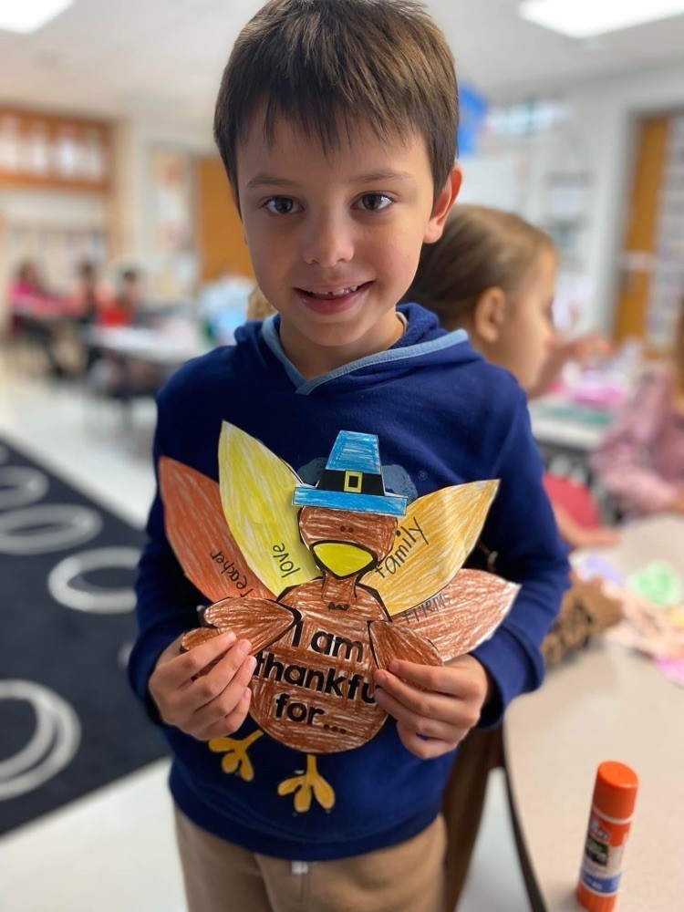 First grader with their thanksgiving project.