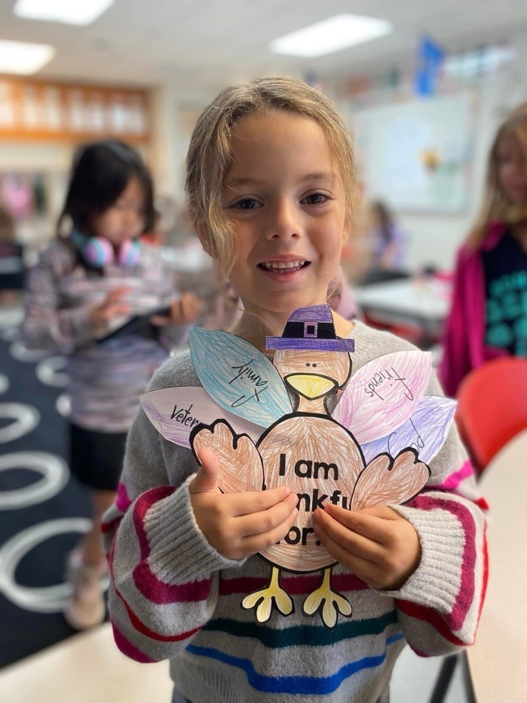 First grader with their thanksgiving project.
