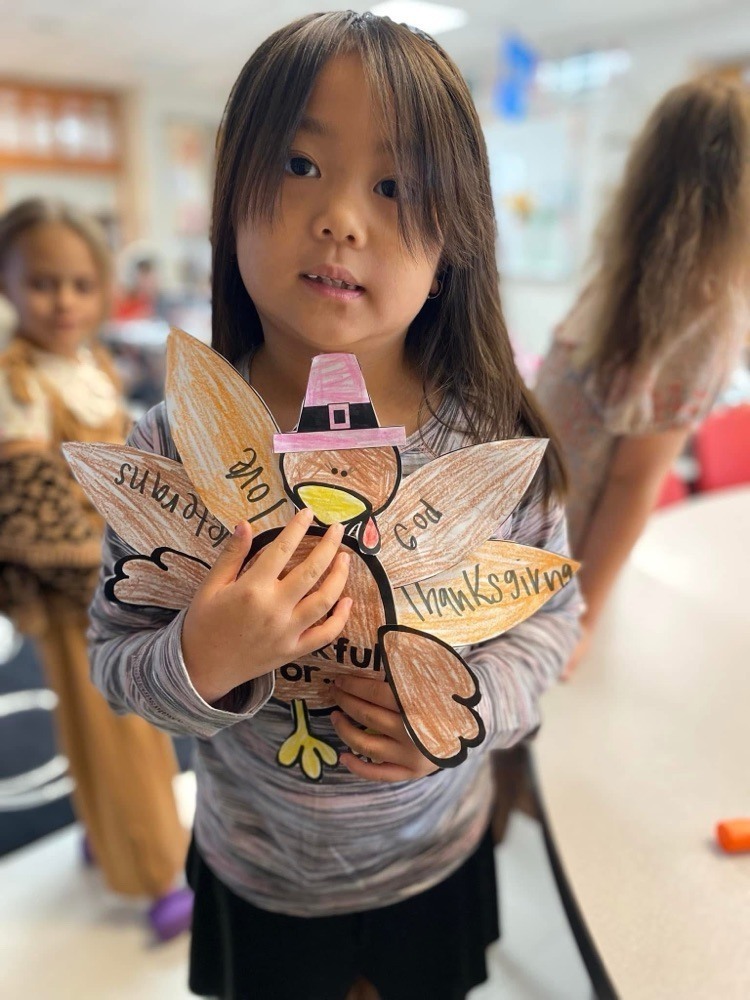 First grader with their thanksgiving project.