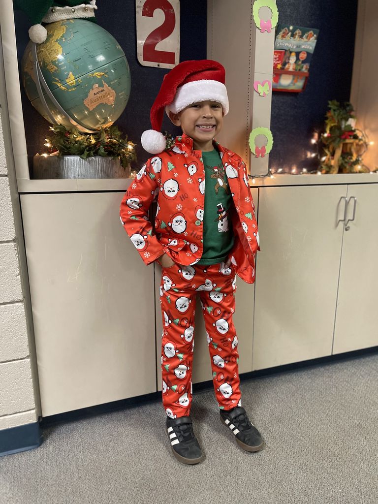 student in Christmas suit