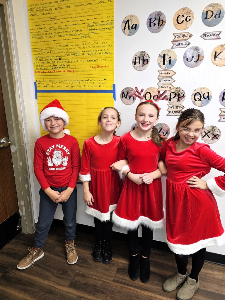 students smiling with Christmas gear