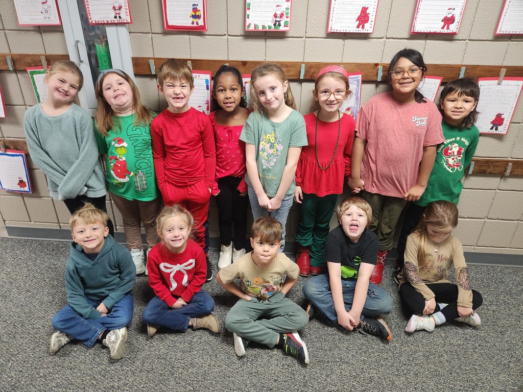 students smiling with Christmas gear
