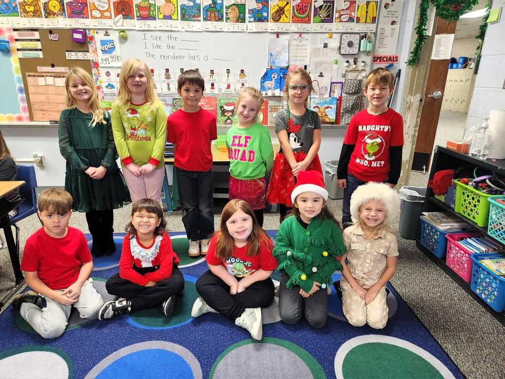 students smiling with Christmas gear