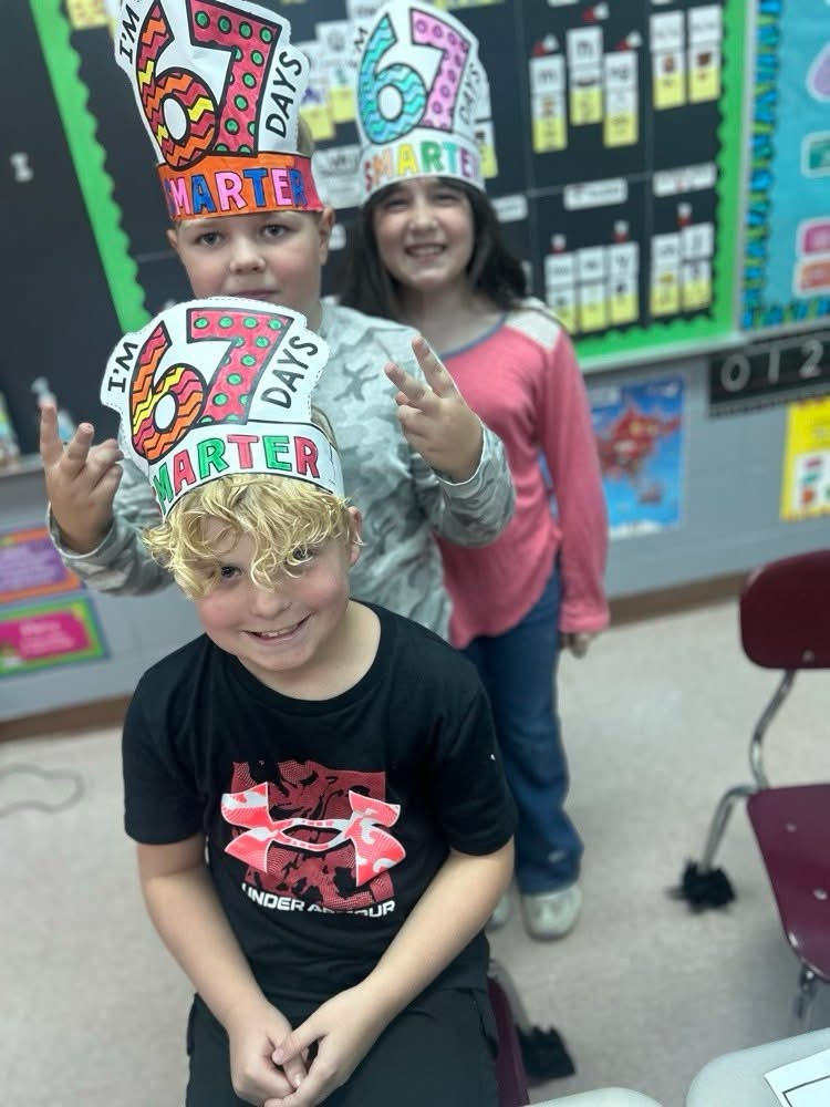 three students smiling for photo