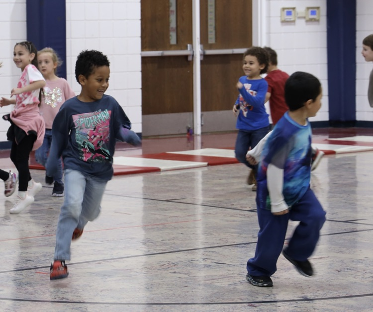 Two boys playing tag