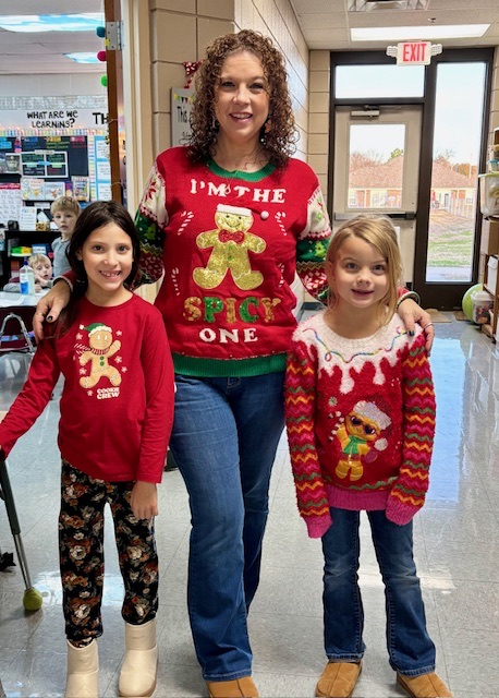sanders and students in ugly sweaters