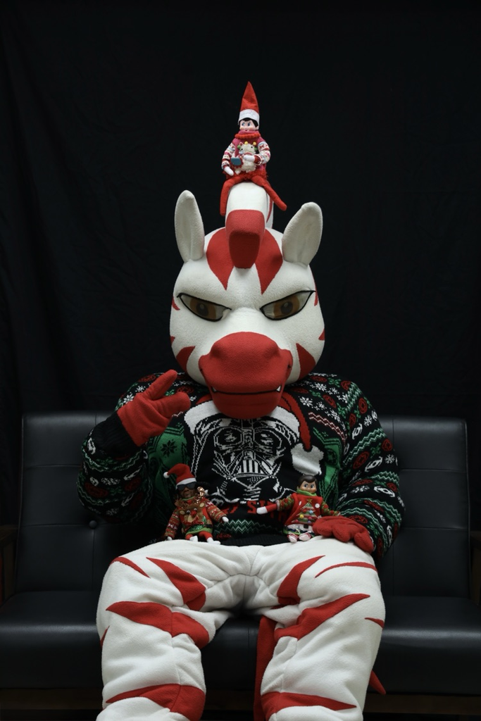 zebs and the elf’s posing for a photo with ugly sweaters 