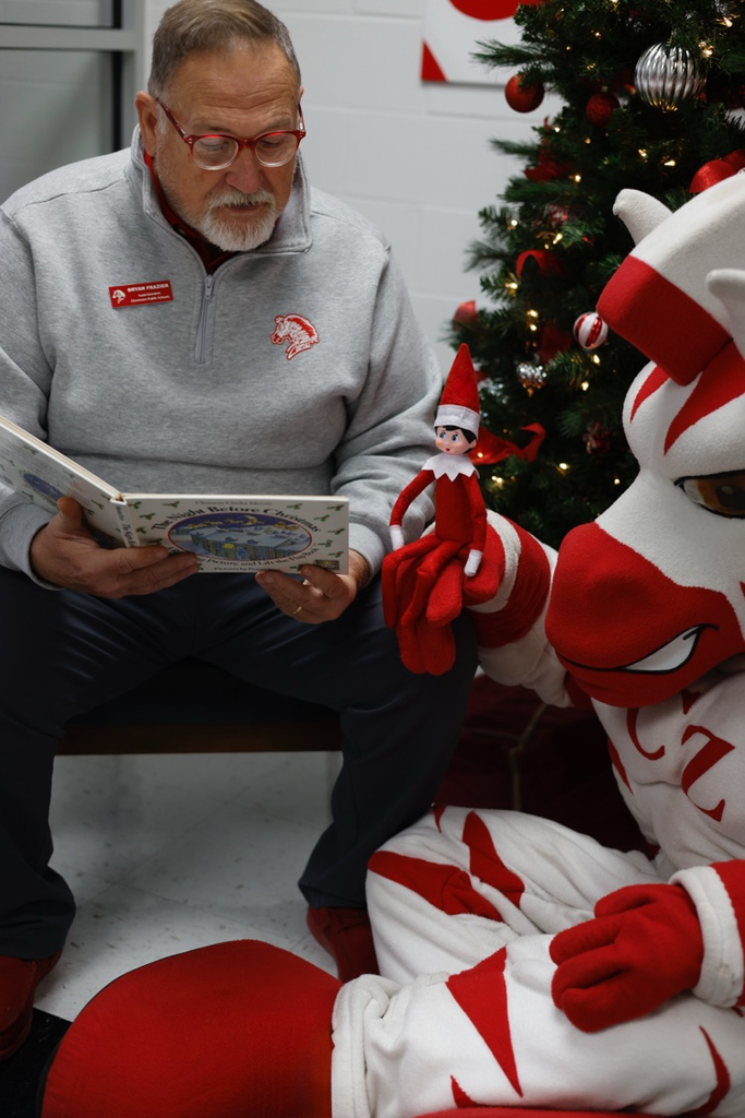 Frazier reading twas the night before Chirstmas book to zebs and dazzle 