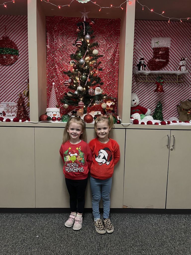 students wearing Christmas sweaters