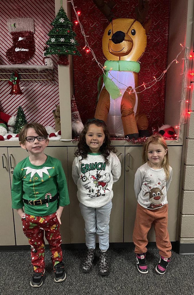 students wearing Christmas sweaters