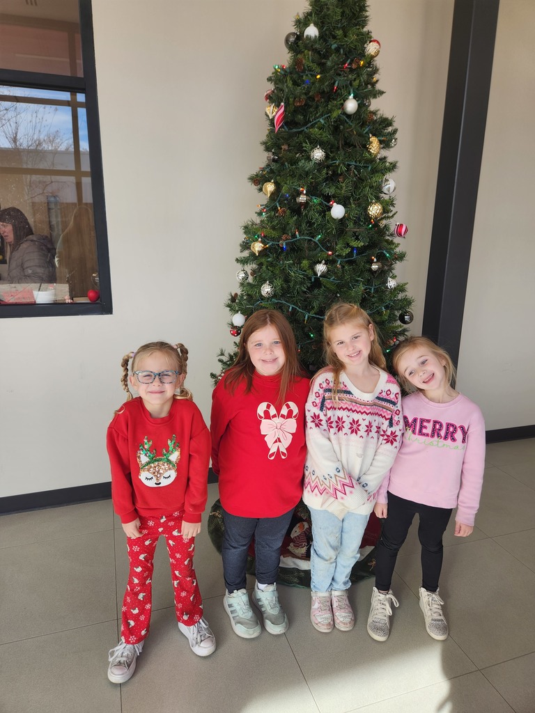 students wearing Christmas sweaters