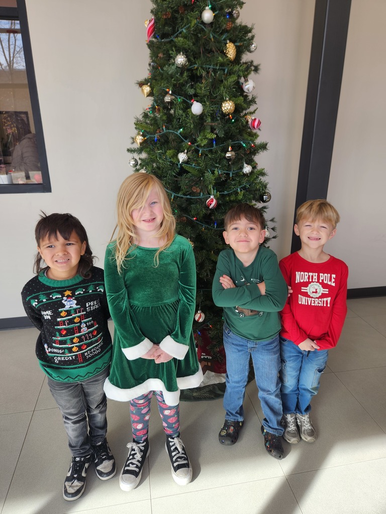 students wearing Christmas sweaters