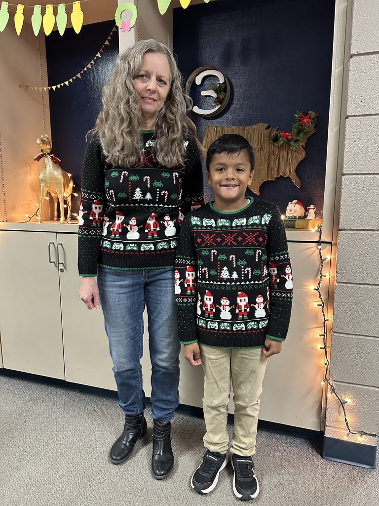 students wearing Christmas sweaters
