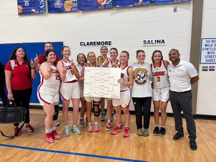 Lady Zebras team photo holding up the trohpy
