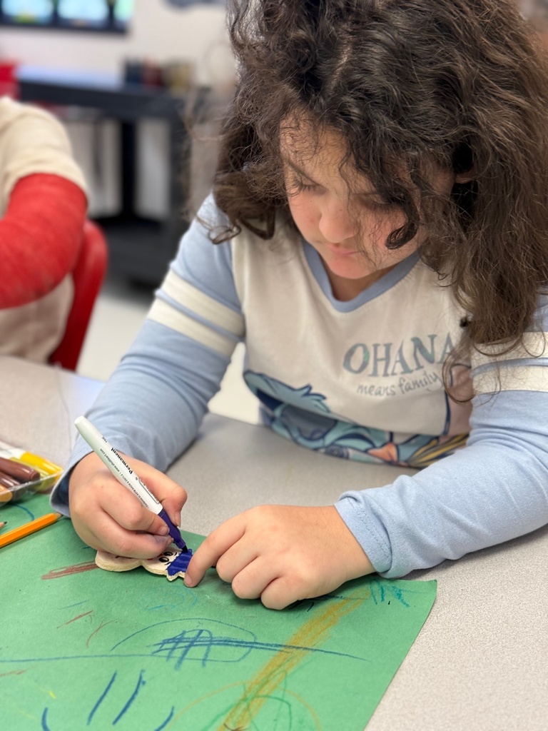 Student looking down and coloring