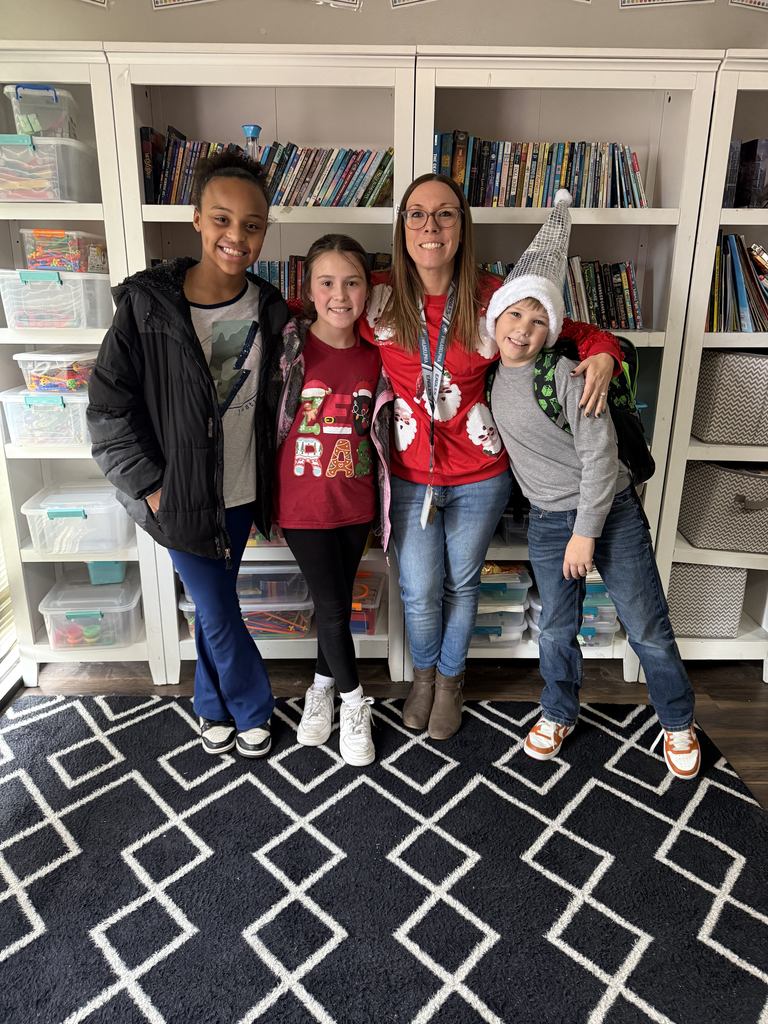 student and staff smiling