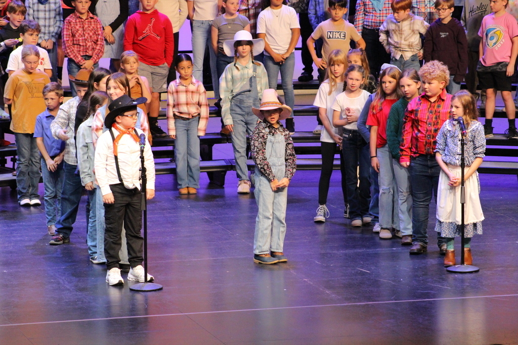 students on stage giving their speaking parts