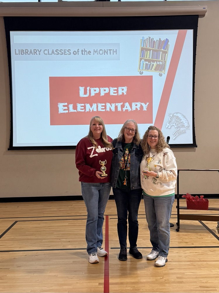 teacher is smiling with librarian