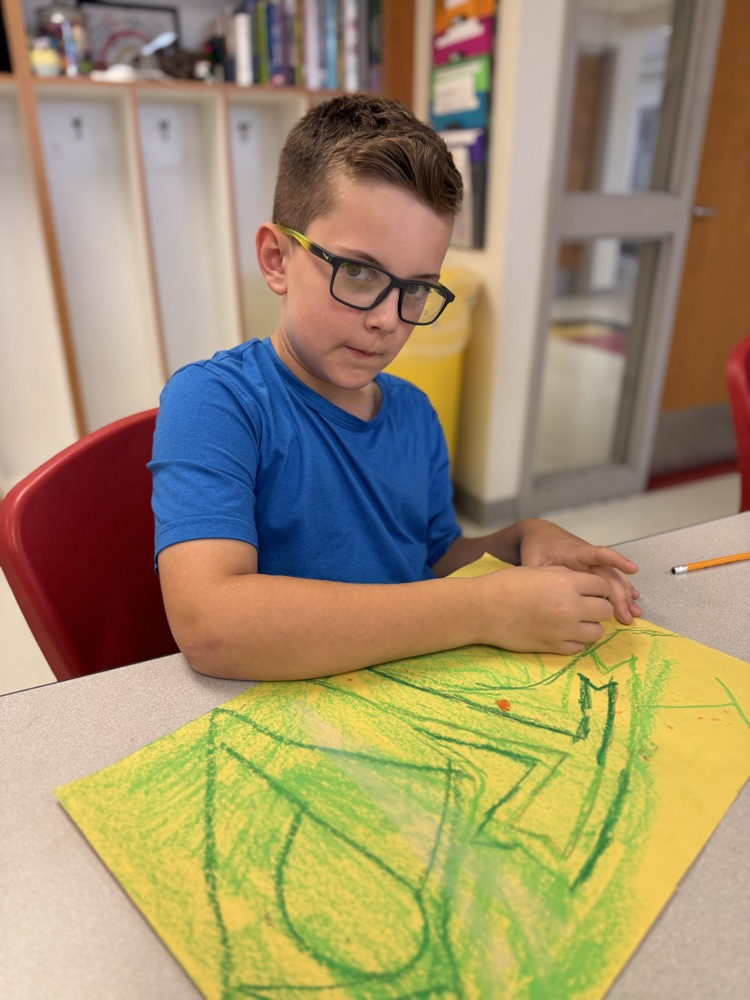 Student working on his art work
