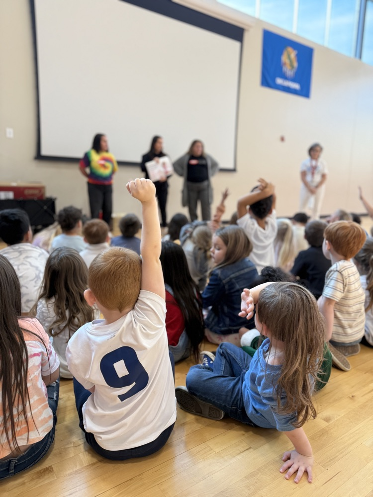 students raising hand