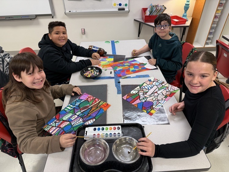 Catalayah students working on art pieces based on their name.