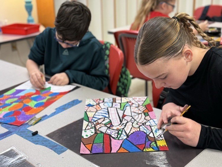 Catalayah students working on art pieces based on their name.