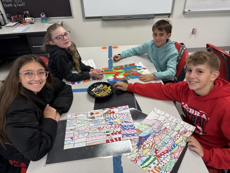 Catalayah students working on art pieces based on their name.