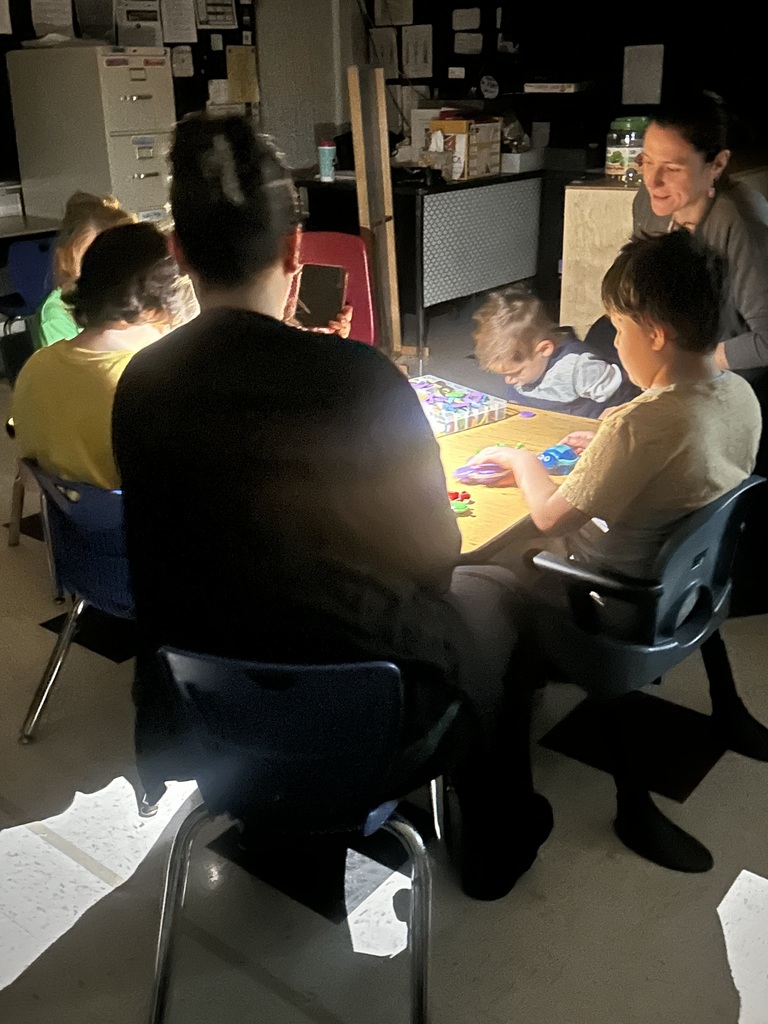 students playing games with a flash light