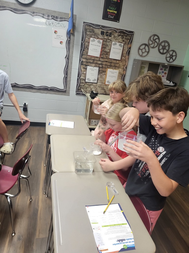 students working with graham crackers and marshmallows 