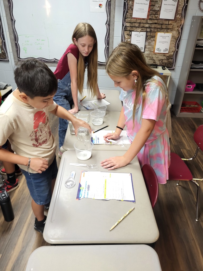 students working with graham crackers and marshmallows 