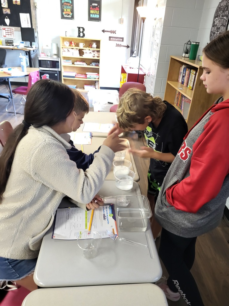 students working with graham crackers and marshmallows 