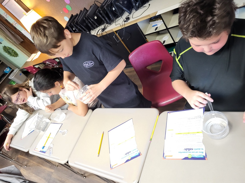 students working with graham crackers and marshmallows 