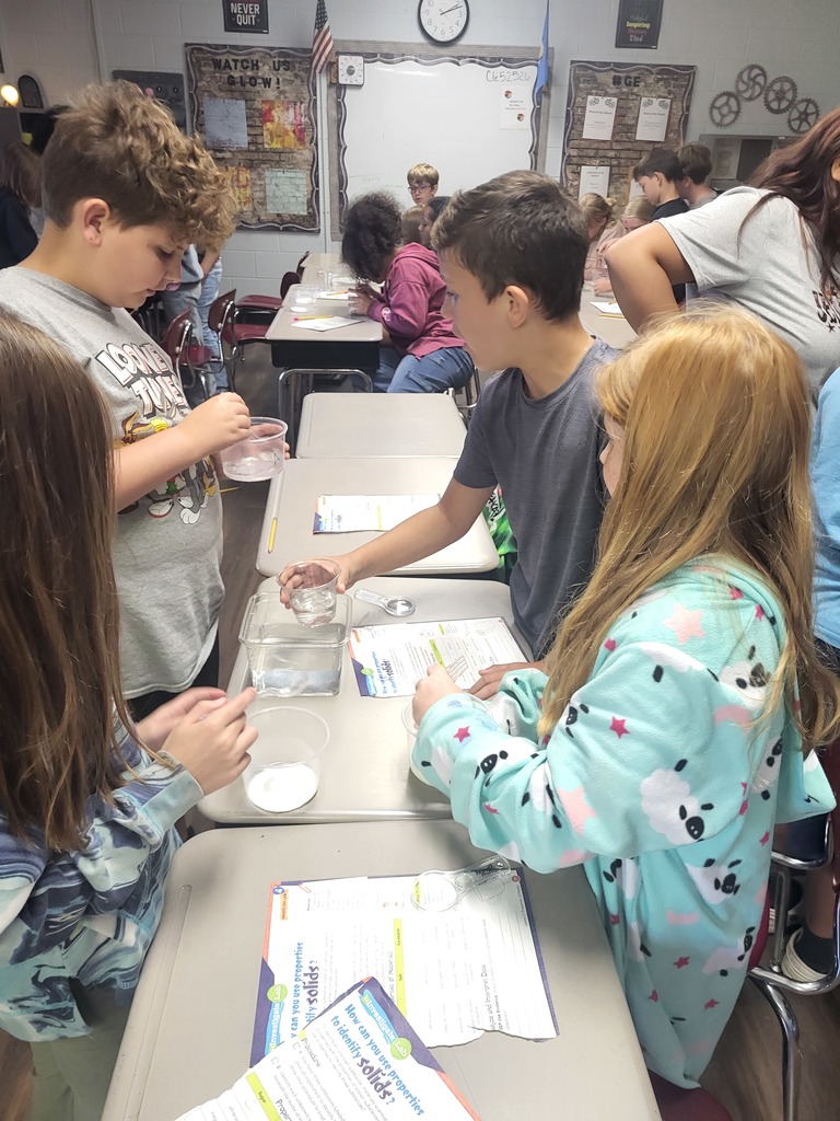 students working with graham crackers and marshmallows 