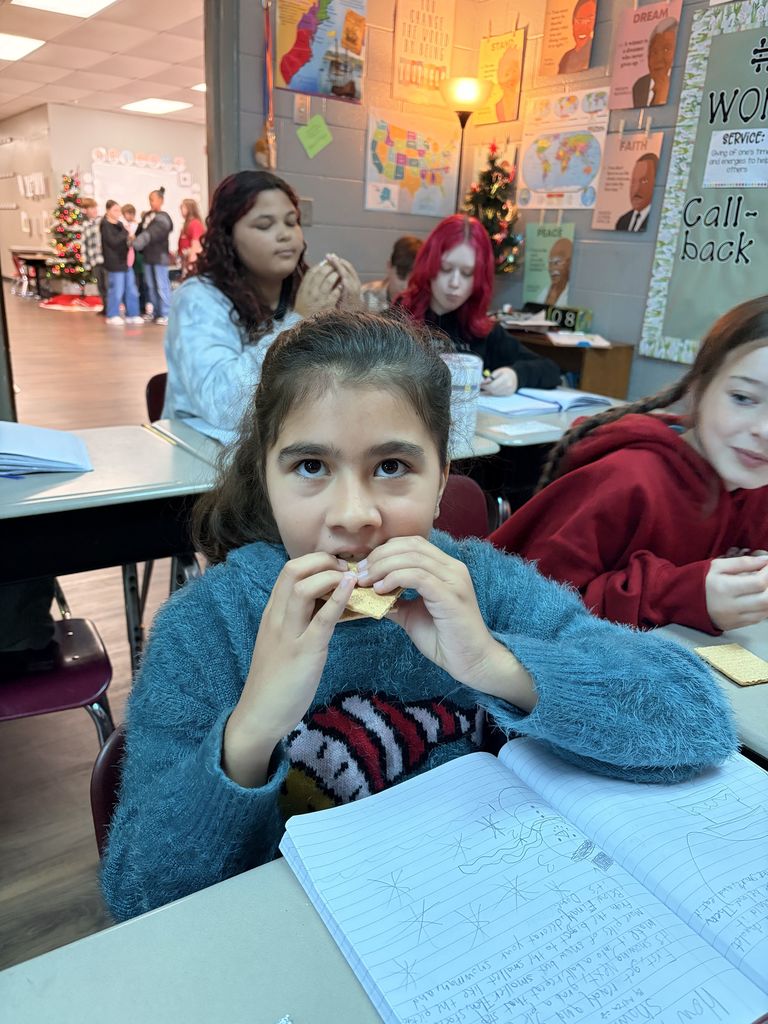 students working with graham crackers and marshmallows 