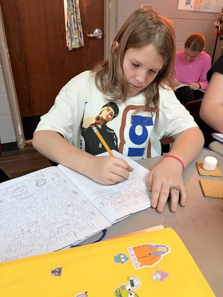 students working with graham crackers and marshmallows 