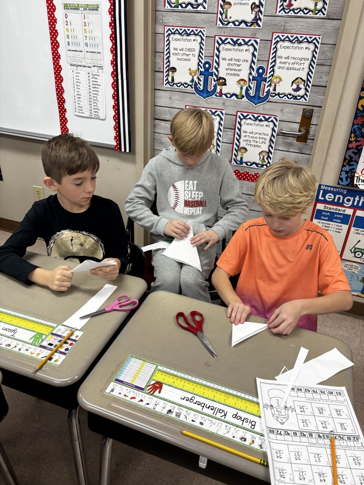 students showing their snowflakes 