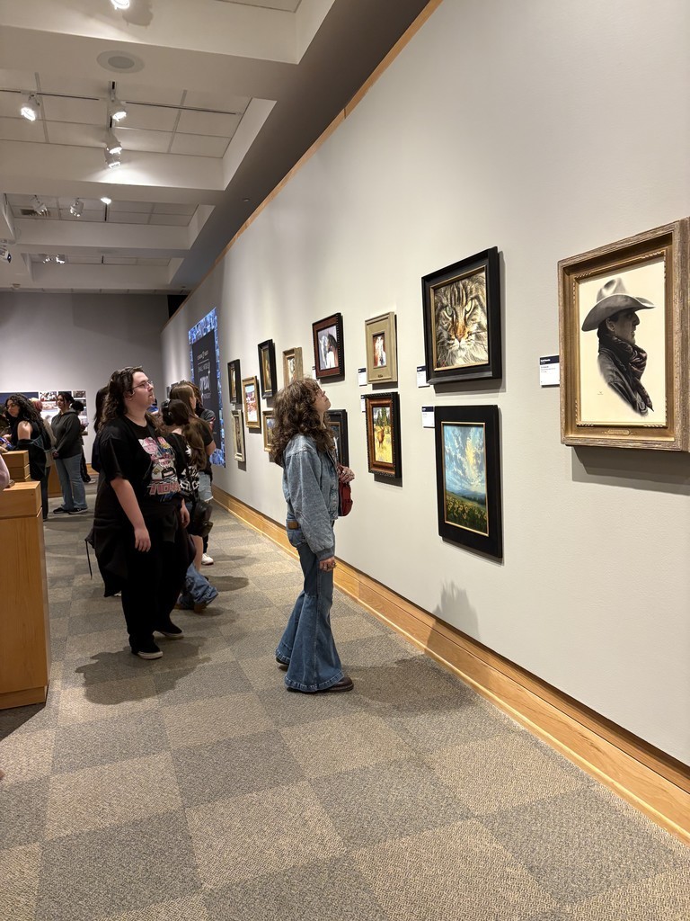 Students looking at art on their trip