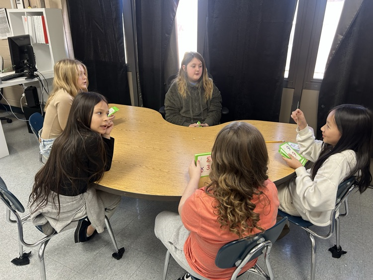 fourth grade girls working on multiplication facts 