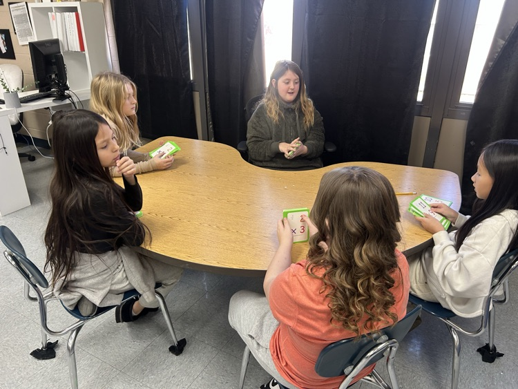 fourth grade girls working on multiplication facts 