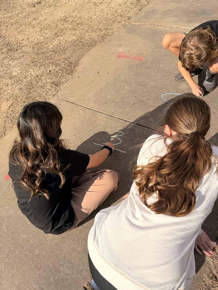students working outside on fractions