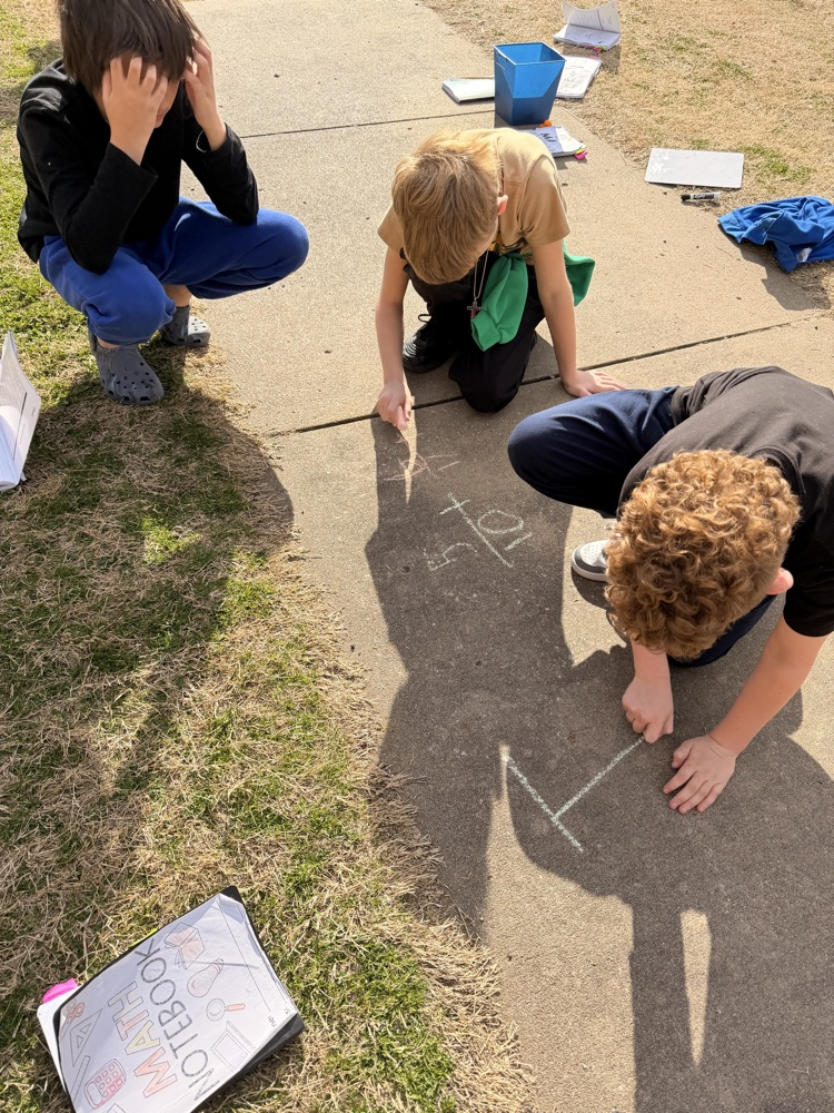 students working outside on fractions