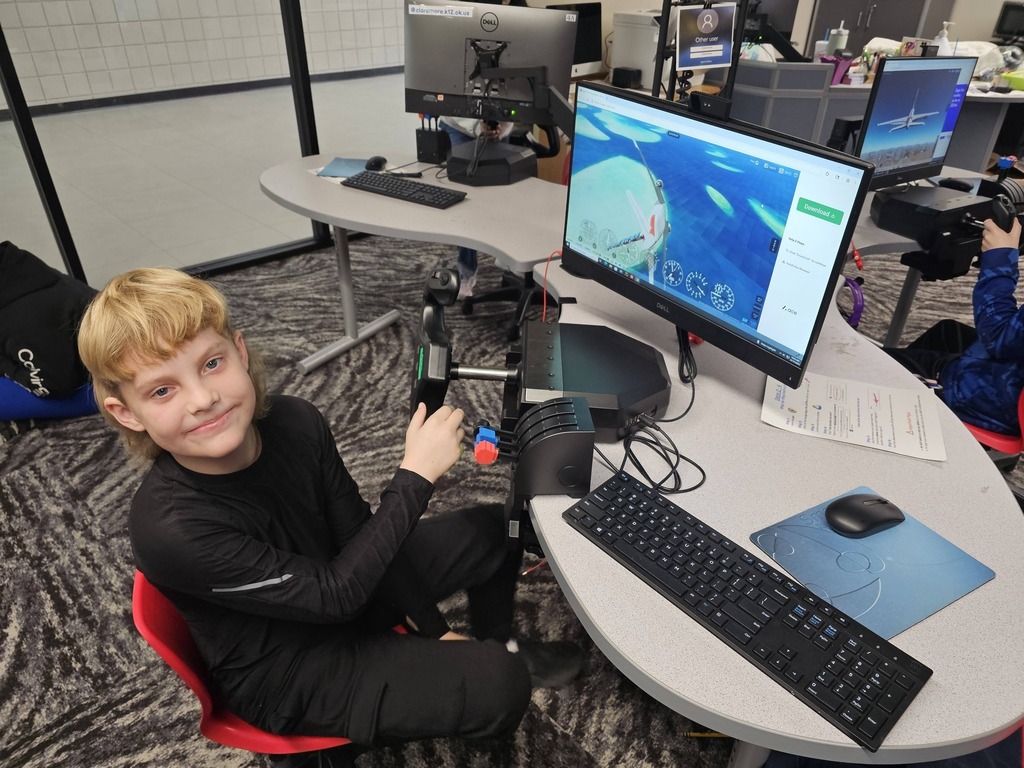 students working on the computer in the stem lab