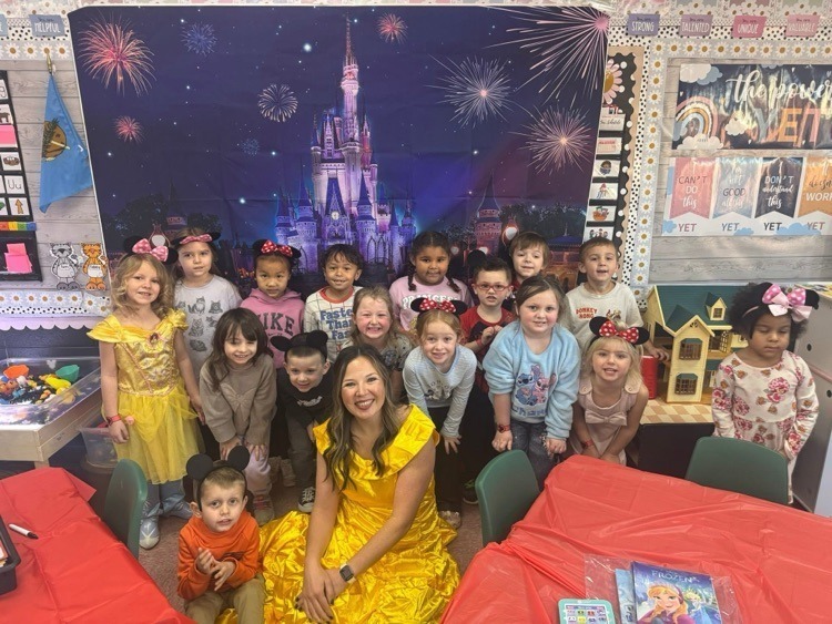 Mrs. Lyonn, dressed as Belle, with her Pre-K students.