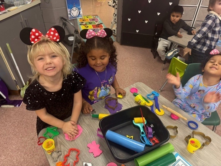 Pre K students with play doh.