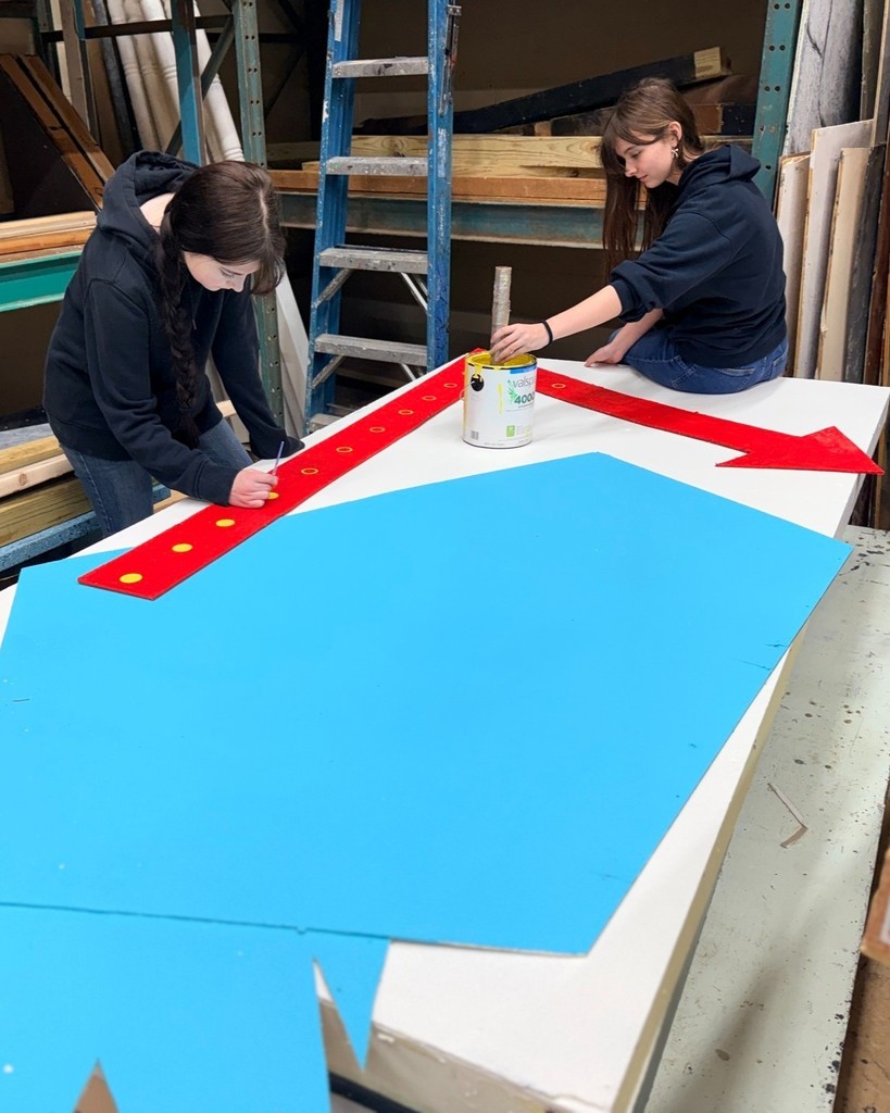High school student working on sets in Theater Production class.