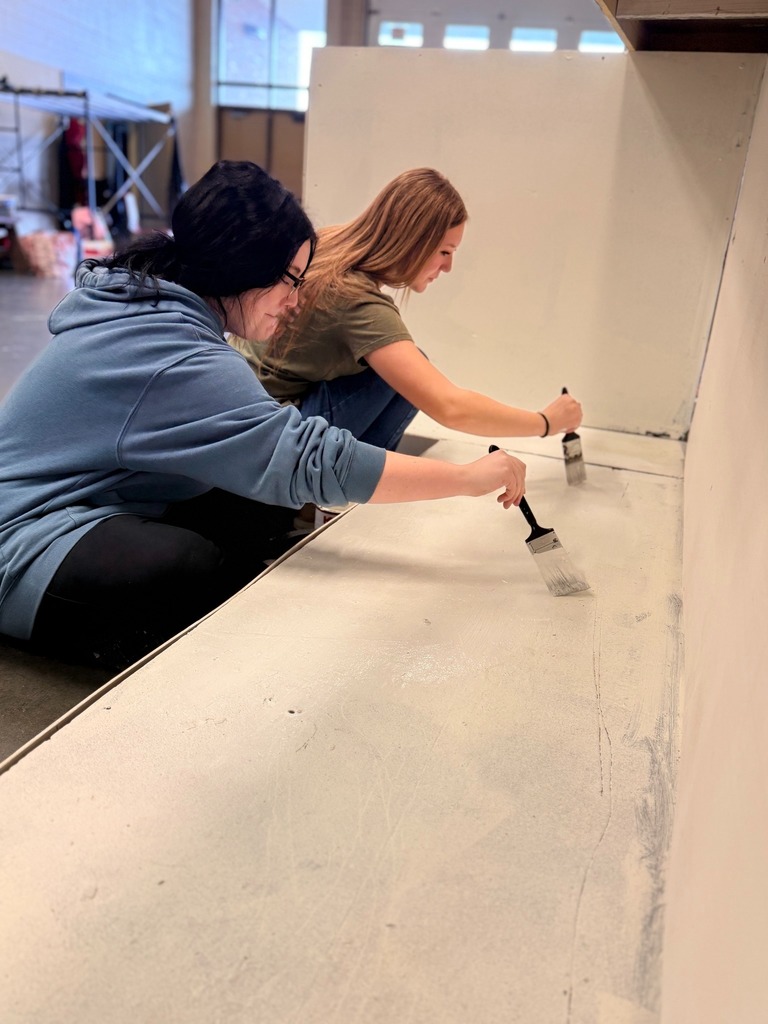 High school student working on sets in Theater Production class.