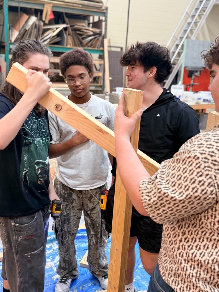 High school student working on sets in Theater Production class.